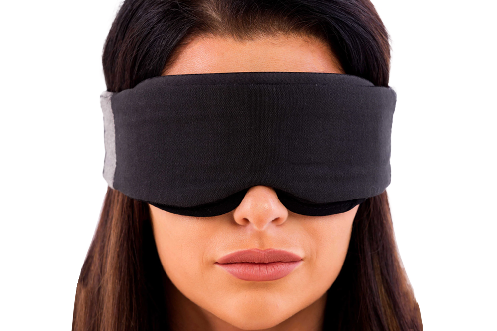 Woman Wearing Low-Profile Contoured Blackout Sleep Mask